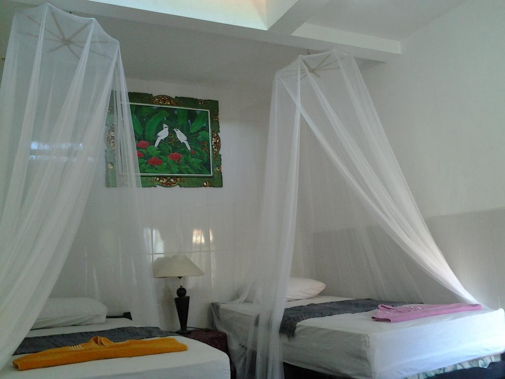 Tirta Yoga Inn Падангбай Стая снимка